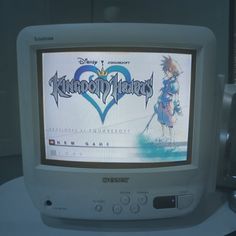 an old computer monitor with the game kingdom hearts on it's display screen, sitting on a table