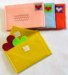 three small pieces of fabric with hearts in them