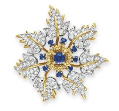 A DIAMOND, SAPPHIRE AND GOLD BROOCH, BY JEAN SCHLUMBERGER, TIFFANY & CO.  Designed as a circular-cut diamond and sculpted 18k gold flower blossom, decorated with circular-cut sapphire accents, mounted in 18k gold and platinum  Signed Schlumberger for Jean Schlumberger, Tiffany & Co. Schlumberger Jewelry, Tiffany Jewellery, Tiffany Bracelet, Jewelry Beauty, Forever Rings, Wise Woman