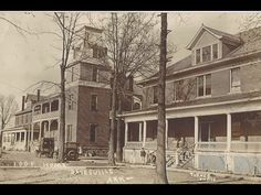 an old black and white photo of some houses