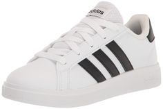 PRICES MAY VARY. Regular fit; Lace closure; Leather upper with synthetic leather details Rubber outsole; Cloudfoam Comfort sockliner; Soft feel Imported; Synthetic lining Set them up to follow in the footsteps of the tennis greats. These kids' adidas shoes have sleek look inspired by '70s court style. The rubber cupsole flexes and grips for smooth and confident strides. Made with a series of recycled materials, this upper features at least 50% recycled content. Kids Tennis Shoes, Kids Tennis, Adidas Grand Court, Adidas Tennis, Black Core, White Core, Adidas Kids, Black 13, Kids Luggage