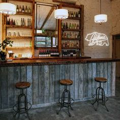 the bar has three stools in front of it