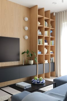 Interior: FRAMUGA studio  Photo: Gabriela Bartczak-Pruszyńska Built In Media Cabinet Ideas, Bookcase Banquette, Full Wall Shelf, Eket Tv, Vinyl Record Furniture, Floating Console, Dnevni Boravak, Dnevna Soba, Living Room Built Ins