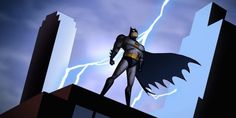 a batman standing on top of a building with lightning in the sky behind him,