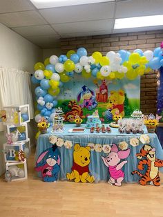 winnie the pooh birthday party with balloons and decorations