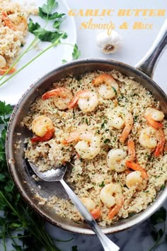 shrimp and rice in a pan with a spoon on the side, ready to be eaten