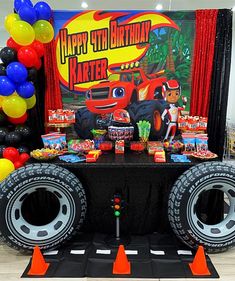 a monster truck birthday party with balloons and decorations