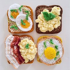 four crocheted pieces of bread with fruit and vegetables on them are arranged in the shape of squares