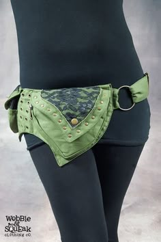 a woman's green belt with gold studs on the side and an open pocket