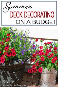 two buckets filled with flowers sitting on top of a wooden table next to a sign that says, summer deck decor on a budget