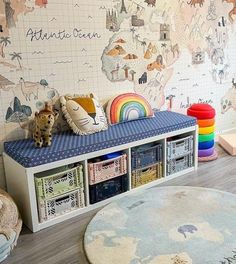 a child's room with colorful wallpaper and toys on the floor, including bookshelves