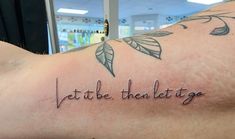 a person with a tattoo on their arm that says, let the then let it go