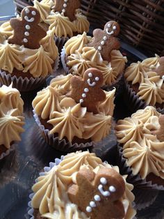 some cupcakes with icing and decorations on them