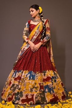 Maroon base attached cancan lehenga with elephant and deer kalamkari hand painted patterns and embroidery. Paired with padded peach blouse embroidered with glass beads and yellow printed dupatta with contrast lace border. - Aza Fashions Peach And Maroon Outfit, Traditional Drape Lehenga With Kalamkari Print For Festivals, Festival Kalamkari Print Lehenga With Traditional Drape, Multicolor Dola Silk Pre-draped Saree For Wedding, Festive Georgette Kalamkari Dupatta, Traditional Kalamkari Lehenga For Festivals, Festive Semi-stitched Kalamkari Print Sharara, Wedding Multicolor Dola Silk Pre-draped Saree, Multicolor Lehenga With Kalamkari Print In Traditional Drape