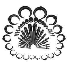 an assortment of black metal fittings and hooks on a white background with space for text