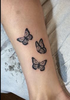 three butterflies tattoo on the ankle