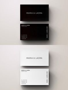 two black and white business cards sitting on top of each other next to each other