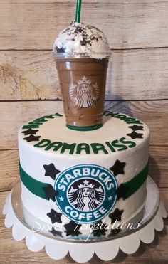 there is a cake with a starbucks drink on it