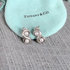 Raretiffany & Co. Infinity Earringsclassic Tiffany & Co. 925 Silverdouble Freshwater Pearls Set Into Each Infinity Earringposts Stamped T&Co 925earring Flower Backs Marked T&Co 925tiffany & Co. Blue Pouch Includedvery Minor Signs Of Gentle Wear, One Post Slightly Bent Very Good Condition Tiffany Infinity Earrings, Infinity Earrings, Post Stamp, Tiffany Co Jewelry, Pearl Set, Earrings Color, Tiffany & Co., Post Earrings, Freshwater Pearls