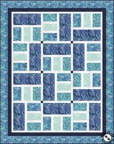 a blue and white quilt with squares on the bottom, one block in the middle