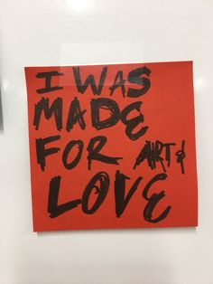 an orange piece of paper with the words i was made for art and love on it