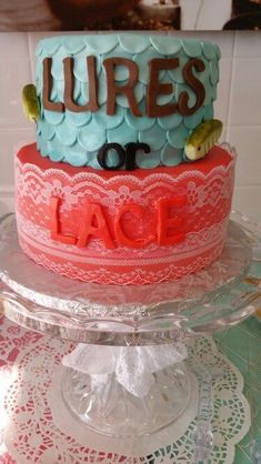 a cake that is on top of a glass plate and has the words lures or lace written on it