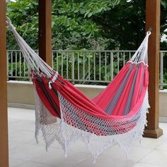 a hammock hanging from a wooden structure