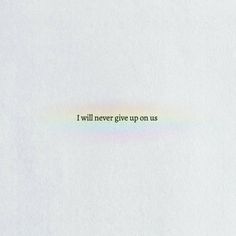 the words i will never give up on us are written in rainbow - colored ink