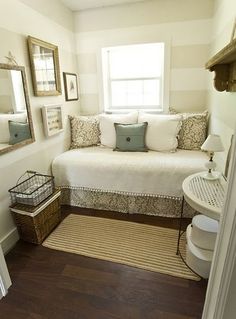 a bedroom with a white bed and pillows