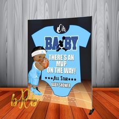 a baby shower sign with an image of a basketball player holding a ball in his hand