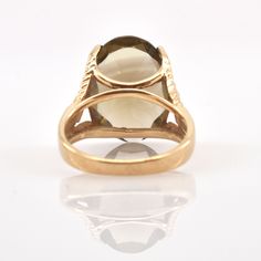 Exquisite 14 karat solid yellow gold ring set to the front with one large oval-cut smoky quartz measuring approximately 18 millimeters long by 13 millimeters wide and weighing an estimated 10.56 carats. The ring is a size 6 1/2 and can be re-sized to fit by your local jeweler. It is stamped 14K and signed AJ. It weighs approximately 6.23 grams. Excellent estate condition. We are listing several pieces of estate jewelry, along with other items fresh from fine North Carolina estates. We are happy Oval Yellow Gold Dome Ring With Prong Setting, Oval Dome Ring In Yellow Gold With Prong Setting, Gold Oval Cabochon Rings, Gold Cabochon Oval Rings, Gold Oval Ring With Prong Setting, Antique Oval Yellow Gold Rings, Gemstone Rings Vintage, Smoky Quartz Ring, Gold Ring Sets