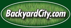 the back yard city logo is shown in white on green grass with an oval border