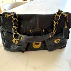 Excellent Condition Few Minor Scratches On Front Buckle. (See Pics) Measurements In Pictures Authentic Coach Brand Black In Color With Gold Hardware Retails For $345 Comes With Duster Bag Smoke Free Home. Gold Handbag, Buckle Bag, Bags Coach, Gold Handbags, Coach Bags, Gold Hardware, Bag Lady, Buckle, Handbags