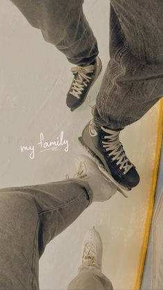 two people standing next to each other with their feet on a skateboard and the words my family above them