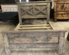 a wooden bed frame sitting on top of a floor