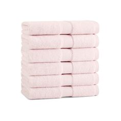 six pink towels stacked on top of each other in front of a white background,