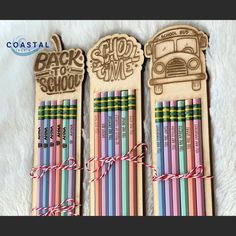 three wooden pencils with the words back to school written on them