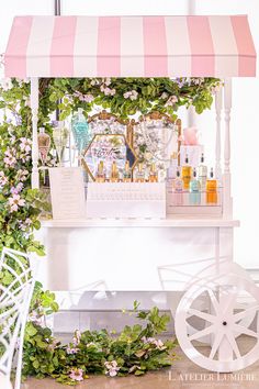 Perfume Bar set up on a pink and white cart with greenery and flowers around the cart on the left. Bridal Shower Perfume Bar, Bridal Shower Coffee Bar, Shower Coffee Bar, Champagne Walls, Custom Perfume, Drink Stations, Garden Bridal Showers