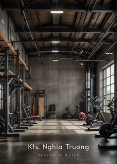 an indoor gym with lots of machines and equipment