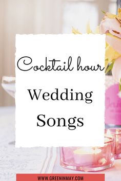 a sign that says cocktail hour wedding songs on the side of a table with flowers