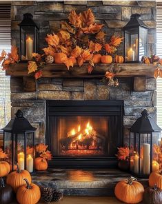 a fireplace decorated with pumpkins and candles