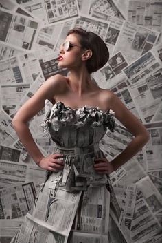 a woman in a dress made out of newspapers