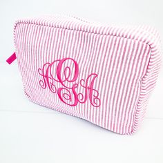 "These seersucker everything bags are a perfect addition to our toddler backpacks or any diaper bag. *Wipe clean water resistant interior lining *Machine wash; line dry *Size: 8\" x 6\" x 4\" All of our products are professionally embroidered (not vinyl or screen print) in our Marietta, GA studio. Personalization is Included! Full Alphabet Previews & Color Options Here: https://www.etsy.com/shop/MariettaMonogramsGA?section_id=32932068" Monogrammed Makeup Bags, Cute Makeup Bags, Toddler Backpack, Pink Monogram, Bag Suitcase, Light Aqua, Bridesmaids Personalized, Toiletry Bag Travel, Makeup Case