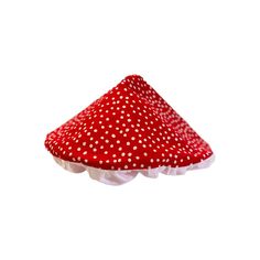 a red and white polka dot covered mushroom on a white background with room for text