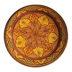 an orange and yellow decorative bowl on a white background with the center flower design painted in gold