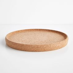 a round cork tray on a white background