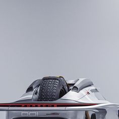 the front end of a silver race car