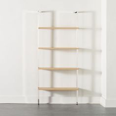 a book shelf with three shelves on each side and two legs in the middle, against a white wall