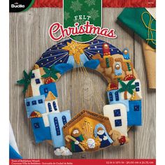 the front cover of felt christmas magazine with an ornament hanging from it's side