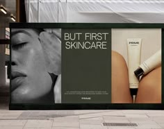 an advertisement for skin care is displayed on the side of a building in front of a woman's face